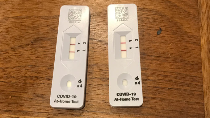 Two rapid result COVID 19 test, both positive for the virus. 